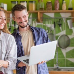 Couple cooking healthy food at house kitchen, preparing lunch